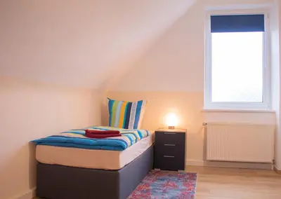 Ein Bett oder Betten in einem Zimmer der Unterkunft Bis 5 Personen, Parkplatz, Arbeitsplatz