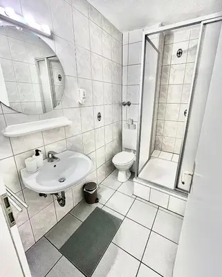 Ein Badezimmer in der Unterkunft Hotel Breuer