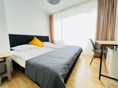 Ein Bett oder Betten in einem Zimmer der Unterkunft Zentrales großzügiges Apartment mit Dachterrasse!