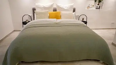 Ein Bett oder Betten in einem Zimmer der Unterkunft Luxuriöse Stadtvilla im Hansaviertel