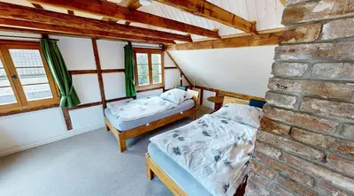 Ein Bett oder Betten in einem Zimmer der Unterkunft Haan-Ferienwohnung