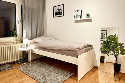 Ein Bett oder Betten in einem Zimmer der Unterkunft Cozy Apartments in Wuppertal