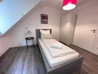 Ein Bett oder Betten in einem Zimmer der Unterkunft Modern Central Apartments near Hbf & Messe Essen