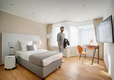 Ein Bett oder Betten in einem Zimmer der Unterkunft Hotel Am Brinkerplatz
