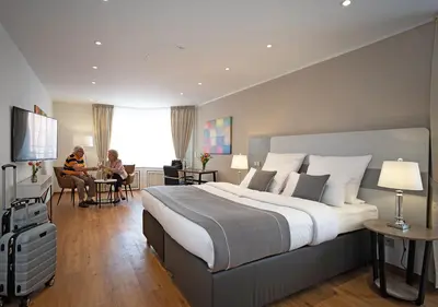 Ein Bett oder Betten in einem Zimmer der Unterkunft Hotel Am Brinkerplatz