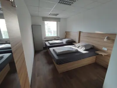 Ein Bett oder Betten in einem Zimmer der Unterkunft City Apartments Essen