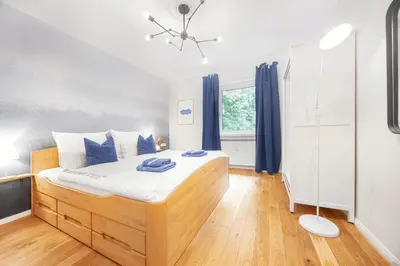 Ein Bett oder Betten in einem Zimmer der Unterkunft FeWo Phönixhütte am Baldeneysee in Kupferdreh