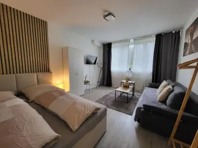Ein Bett oder Betten in einem Zimmer der Unterkunft Stilvolle Wohnung in Wuppertal inkl. Kaffee & Tee