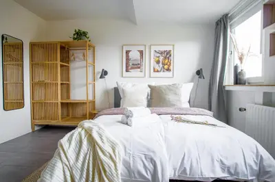 Ein Bett oder Betten in einem Zimmer der Unterkunft HOMEFY - Studio Sky