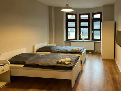 Ein Bett oder Betten in einem Zimmer der Unterkunft Ein Nachbar des Unesco-Weltkulturerbes Zeche Zollverein! GE2R
