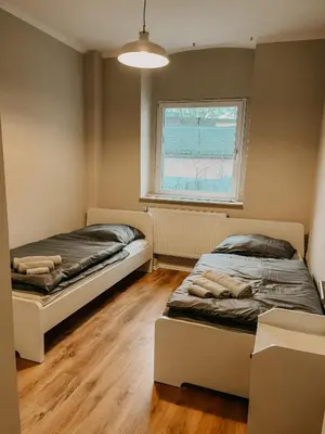 Ein Bett oder Betten in einem Zimmer der Unterkunft Gemütliche 93m² Wohlfühlfläche mit Ausblick zum Weltkulturerbe!