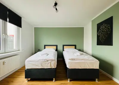 Ein Bett oder Betten in einem Zimmer der Unterkunft Sali - Apartment Essen - Comfort