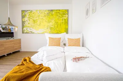 Ein Bett oder Betten in einem Zimmer der Unterkunft HOMEFY - Come Together Apartment