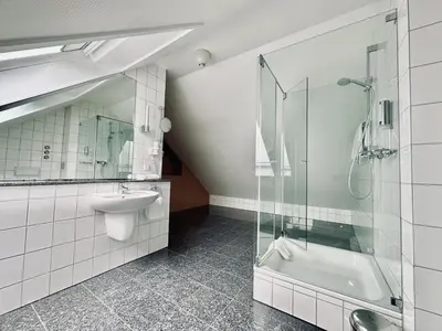 Ein Badezimmer in der Unterkunft AvidonApartments