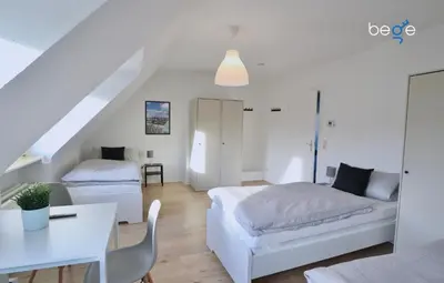 Ein Bett oder Betten in einem Zimmer der Unterkunft BEGE APARTMENTS Corporate Stay