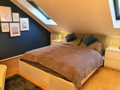 Ein Bett oder Betten in einem Zimmer der Unterkunft Modernes und ruhiges Appartement mit Loggia