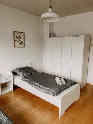 Ein Bett oder Betten in einem Zimmer der Unterkunft Zentral, ruhig, Messe Universitätsklinikum nah! MA3L