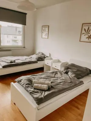 Ein Bett oder Betten in einem Zimmer der Unterkunft Zentral, ruhig, Messe Universitätsklinikum nah! MA3L