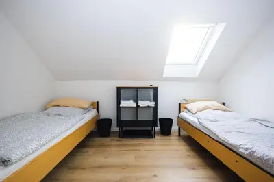Ein Bett oder Betten in einem Zimmer der Unterkunft Häusliches Loft Wohnung Apartment im Herzen von Ratingen
