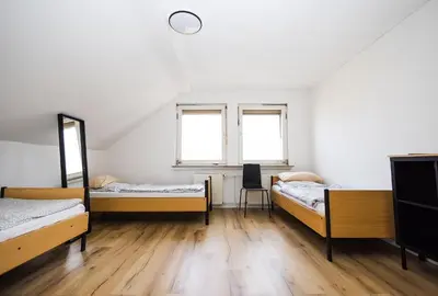 Ein Bett oder Betten in einem Zimmer der Unterkunft Häusliches Loft Wohnung Apartment im Herzen von Ratingen