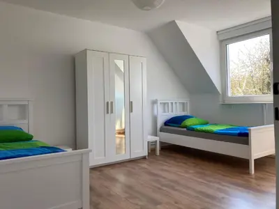 Ein Bett oder Betten in einem Zimmer der Unterkunft gemütliche Altbauwohnung im Wuppertaler Westen