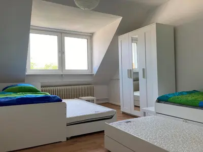 Ein Bett oder Betten in einem Zimmer der Unterkunft gemütliche Altbauwohnung im Wuppertaler Westen