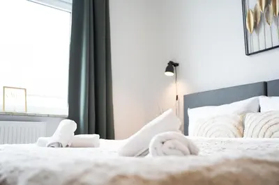 Ein Bett oder Betten in einem Zimmer der Unterkunft Stadtwohnung Helene in Messenähe