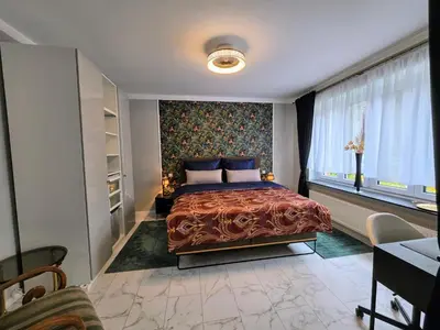 Ein Bett oder Betten in einem Zimmer der Unterkunft HR Haus unter den Linden