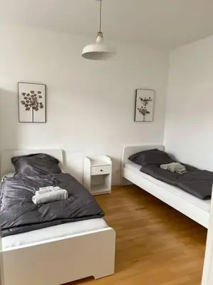 Ein Bett oder Betten in einem Zimmer der Unterkunft Zentral, gemütlich, Messe nah! BE1L