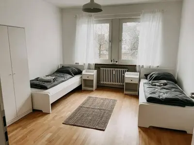 Ein Bett oder Betten in einem Zimmer der Unterkunft Geräumig, zentral, Messe nah! BE1R