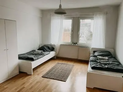 Ein Bett oder Betten in einem Zimmer der Unterkunft Zentral, geräumig, Messe nah! BE2R