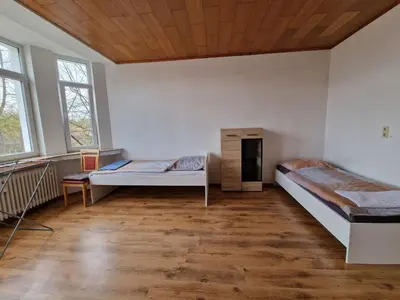 Ein Bett oder Betten in einem Zimmer der Unterkunft K&K Unterkunft GbR, Wohunung 3