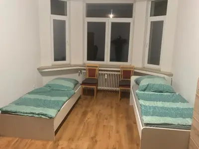 Ein Bett oder Betten in einem Zimmer der Unterkunft K&K Unterkunft GbR, Wohunung 3