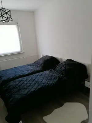 Ein Bett oder Betten in einem Zimmer der Unterkunft gemütliche Wohnung in GE Bulmke-Hüllen