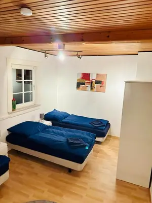Ein Bett oder Betten in einem Zimmer der Unterkunft Gästehaus zum Alten Feilenhauer