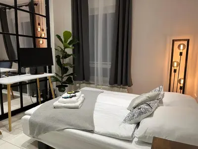 Ein Bett oder Betten in einem Zimmer der Unterkunft BienveniDUS - self service accommodation - Unterkunft zur Selbstversorgung - Das Messezimmer - Düsseldorf
