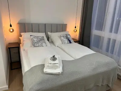 Ein Bett oder Betten in einem Zimmer der Unterkunft BienveniDUS - self service accommodation - Unterkunft zur Selbstversorgung - Das Messezimmer - Düsseldorf