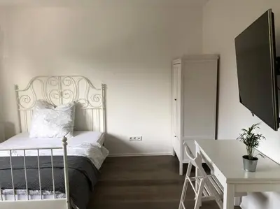 Ein Bett oder Betten in einem Zimmer der Unterkunft Mini Appartement Messezimmer Nähe Düsseldorf, Appartement 25 qm Hilden