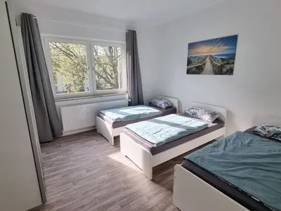 Ein Bett oder Betten in einem Zimmer der Unterkunft Viktoria's Appartment in OB-Mitte