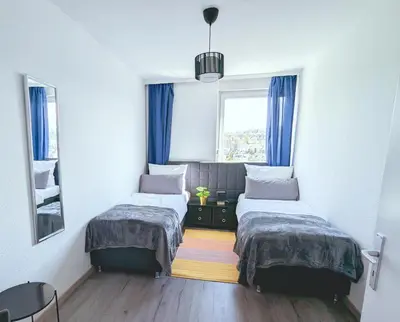 Ein Bett oder Betten in einem Zimmer der Unterkunft Modern flat with elevator/balcony/parking