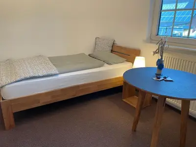 Ein Bett oder Betten in einem Zimmer der Unterkunft Landhaus am Loh